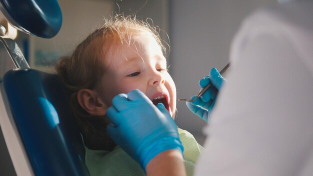 Little child in stomatology chair - close up shot