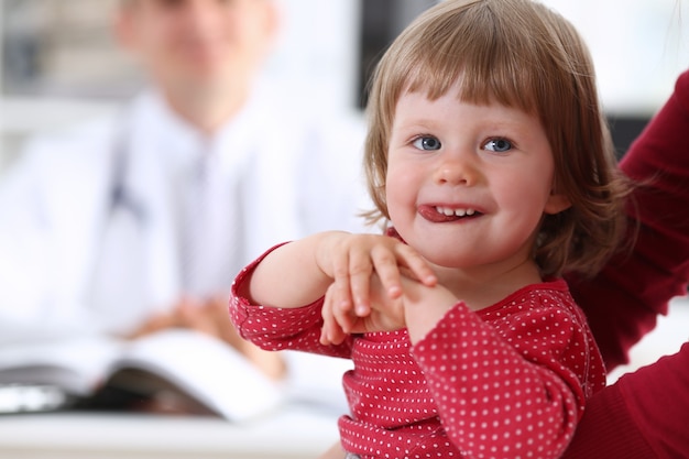 Little child with mother at pediatrician reception