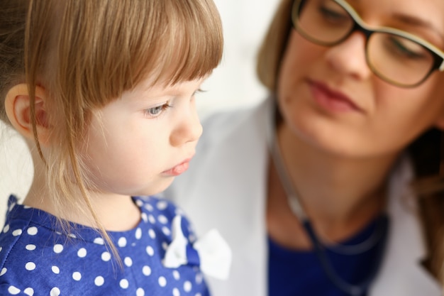 Little child with mother at pediatrician reception