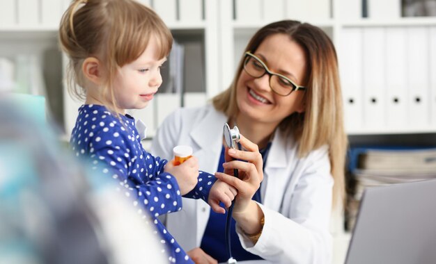 Little child with stethoscope at doctor reception