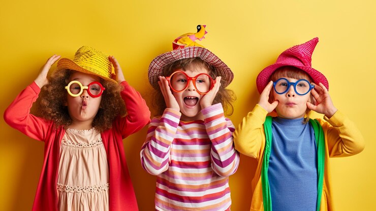 Photo little children in funny disguise on color background april fools day celebration