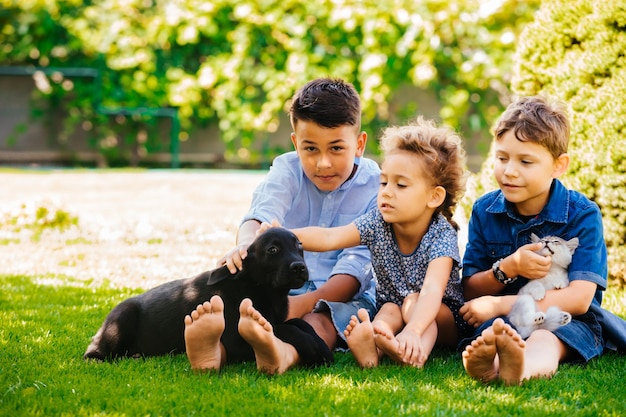 Little children have a great time with their favorite animals