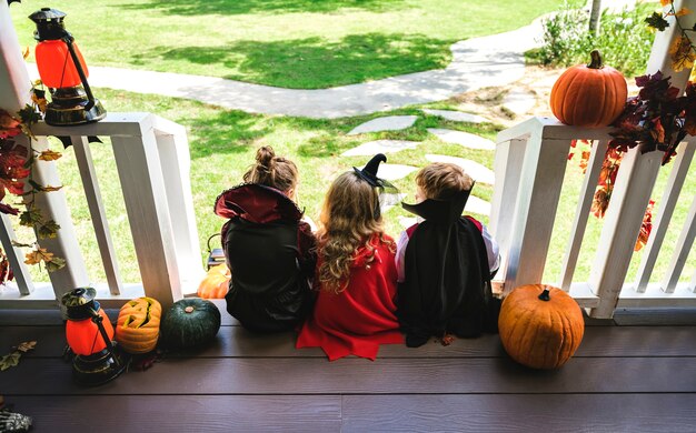 Photo little children trick or treating