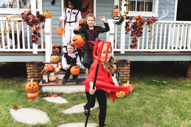 Photo little children trick or treating