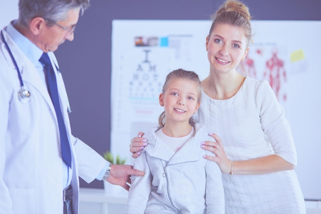 Little children with her mother at a doctor on consultation