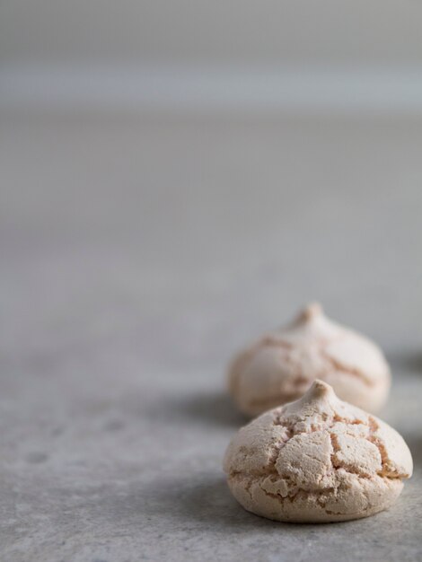 little cream meringues on a gray background