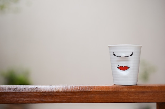 Little cup with woman's face