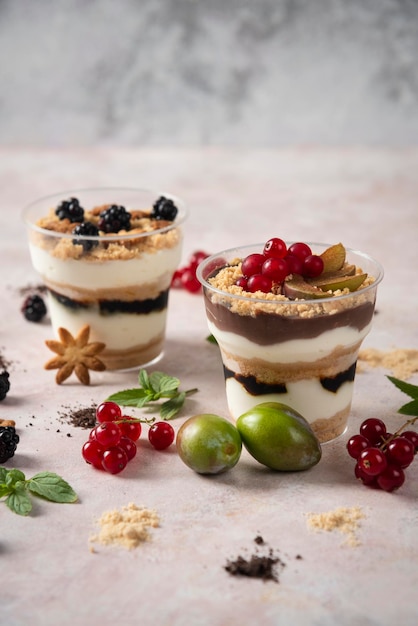 Little cupcakes on white backround with mixed fruits