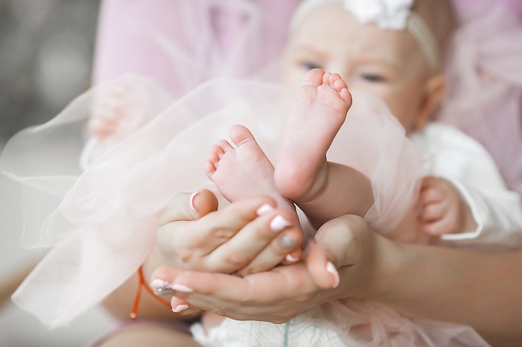 Photo little cute baby`s feet closeup photo