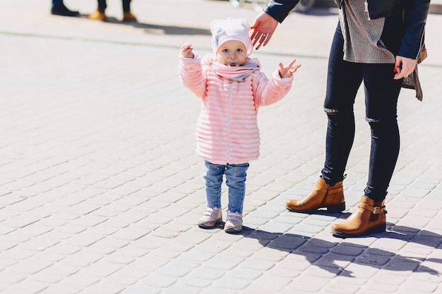 Little cute baby walk on square with birds