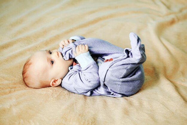 Photo little cute cheerful baby on bed