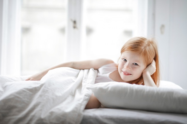 Little cute girl in bed