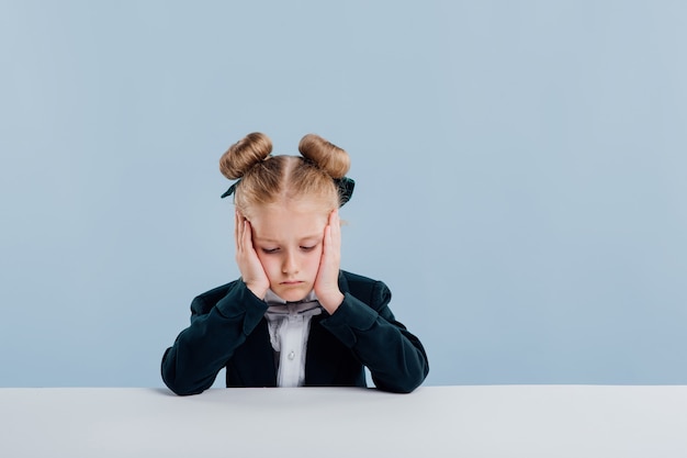 Little cute girl wearing a black suit and a bow