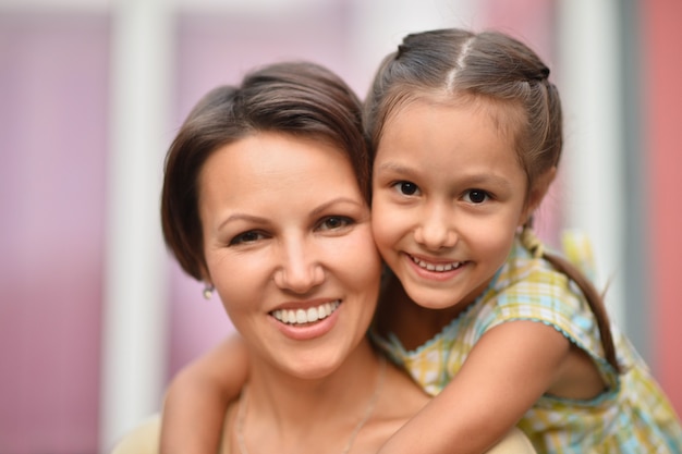 Little cute girl with mother in park