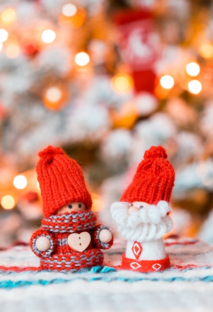 Little cute gnomes at christmas tree background