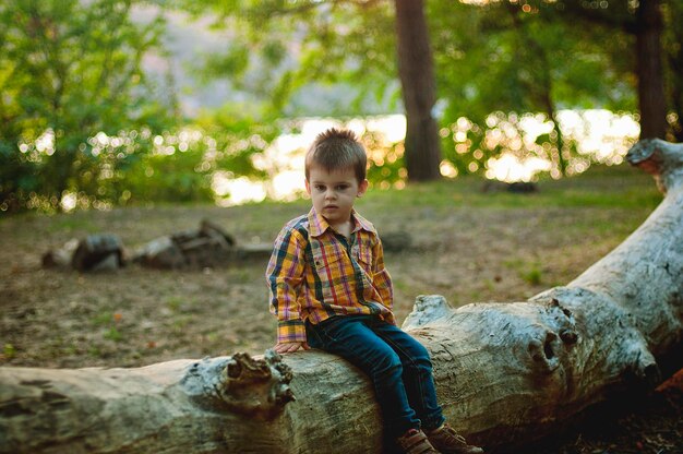 Little cute, happy boy playing in the park, playground, laughing, having fun. Family lifestyle. Kids