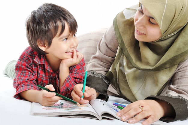 A little cute kid painting on white background