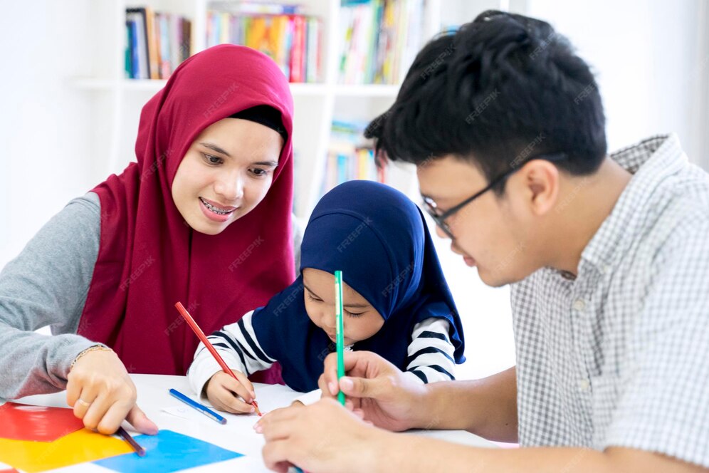 Premium Photo | Little daughter drawing on paper with parents