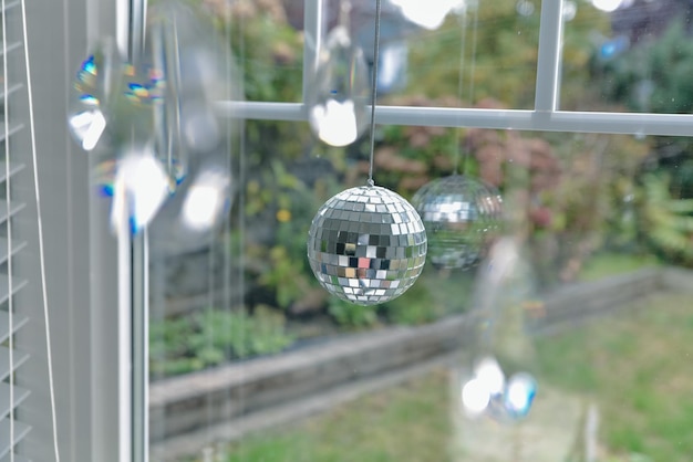 Little disco ball sees by the window