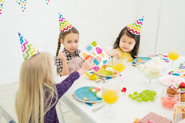 Little friends congratulating birthday girl