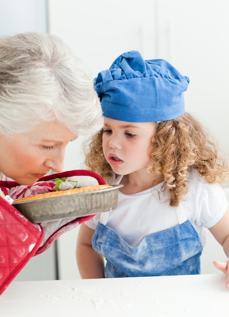 A little girl  baking with her grandmother 