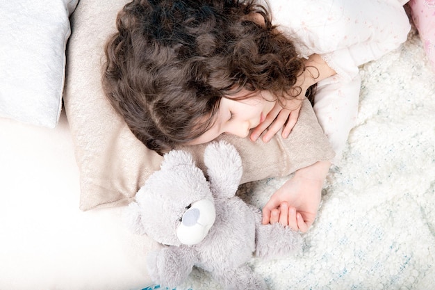 Little girl on blue background