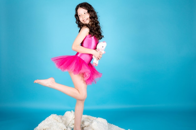 Little girl on blue background