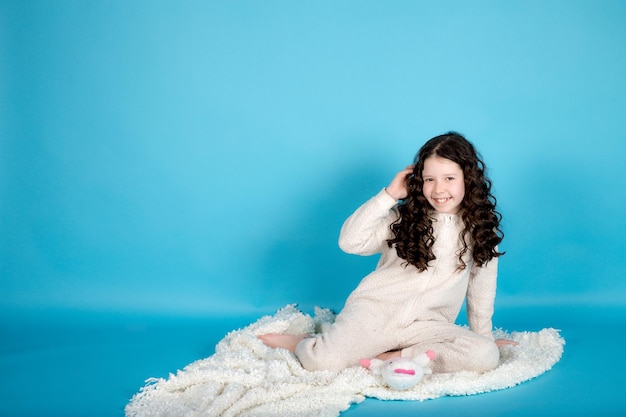 Little girl on blue background