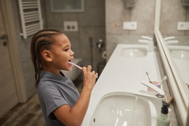 Little Girl Brushing Teeth Side View