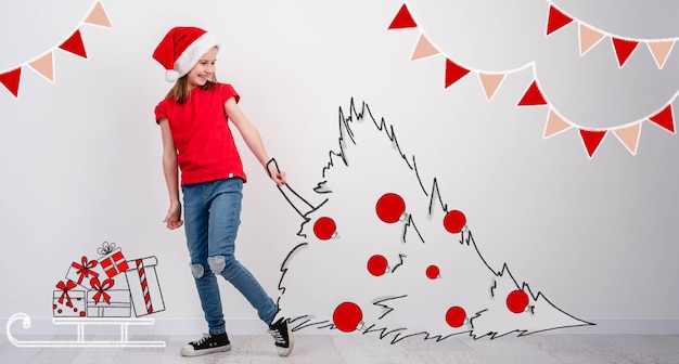 Little girl carrying sketch of christmas tree