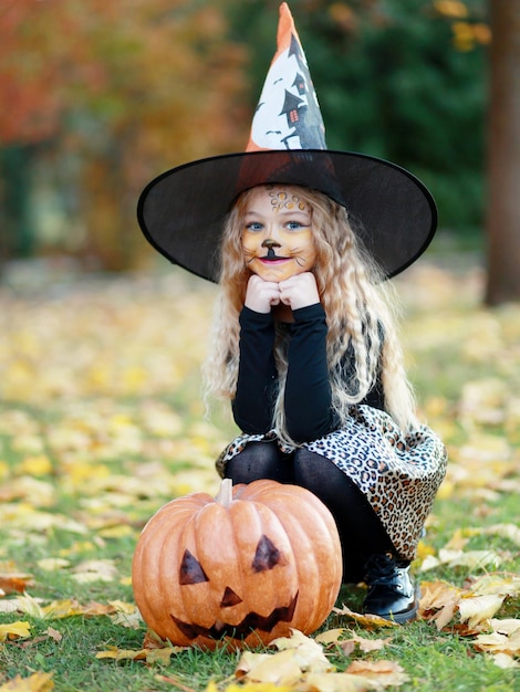 Little girl celebrates Halloween in the park