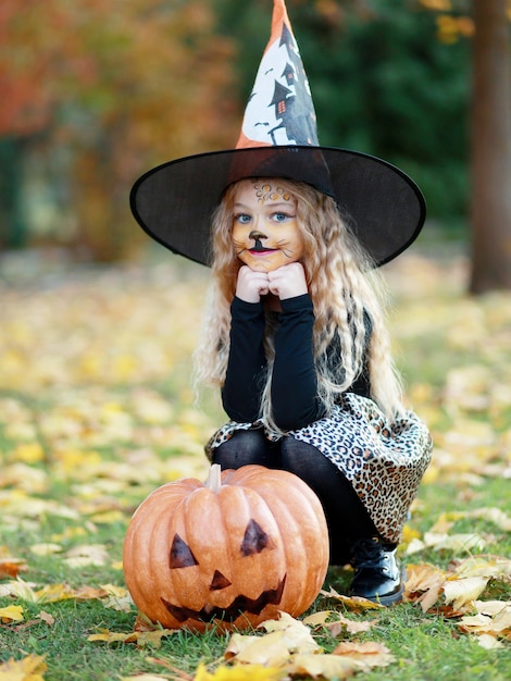 Little girl celebrates Halloween in the park