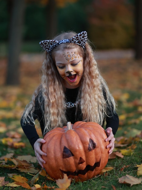 Little girl celebrates Halloween in the park