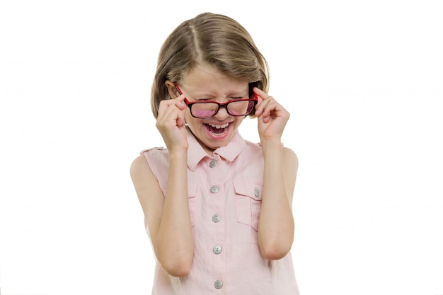 Little girl child in glasses screaming, crying