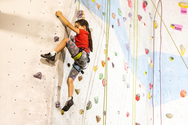 Little Girl Climbing Rock Wall