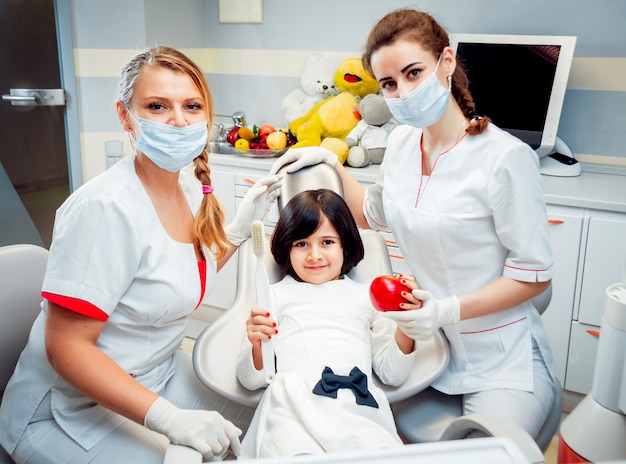 Little girl at the dental office. Calm and happy.