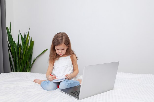 Little girl doing homework at home