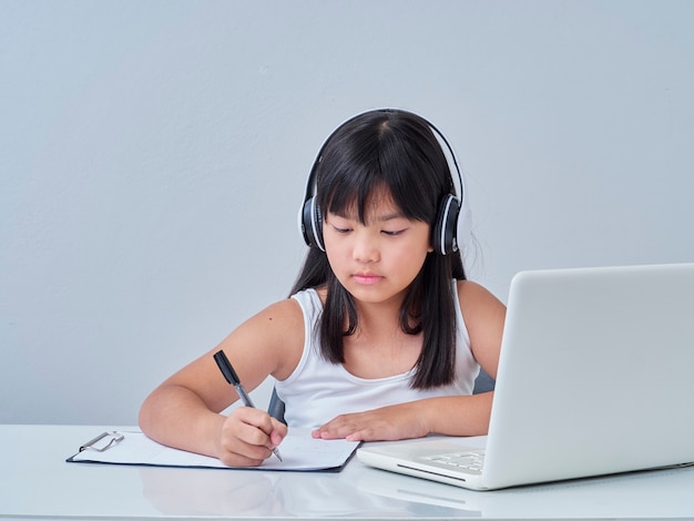 Little girl doing online class