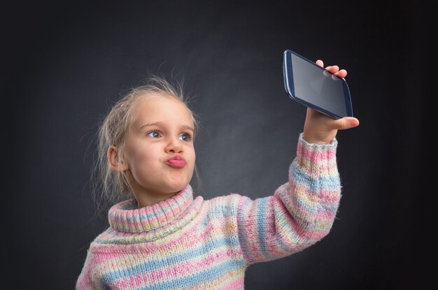 Little girl doing selfie