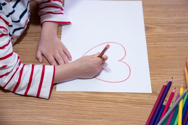 Little girl drawing on floor