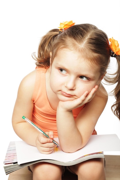 Little girl drawing isolated on white