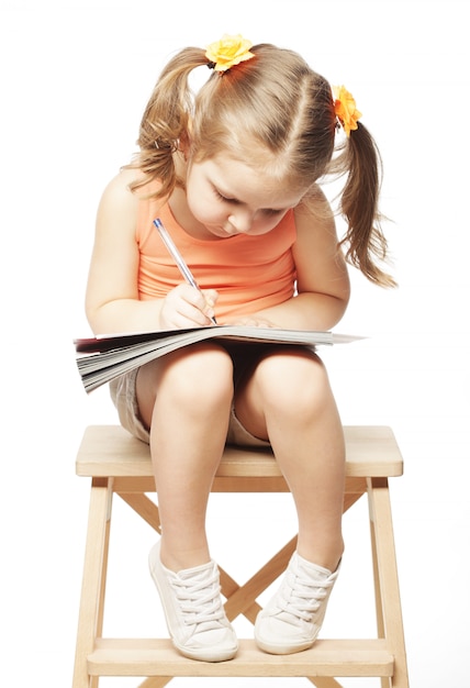little girl drawing  isolated on white