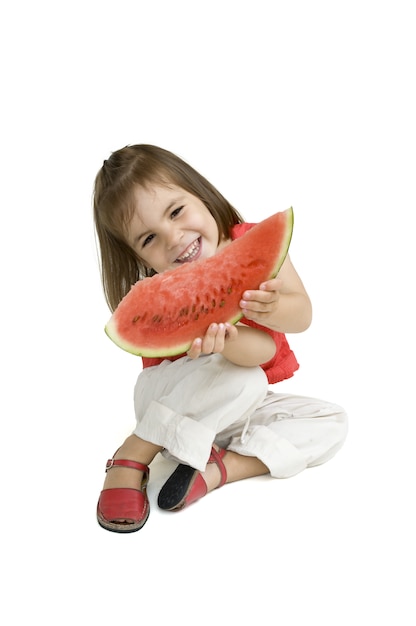 little girl eating watermelon isolated