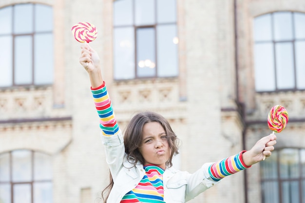 Photo little girl enjoy summer vacation eat sweets, rebel teen concept.