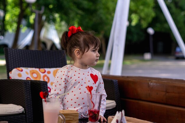 little girl enjoying a refreshed juice on a hot summer day