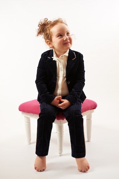 Photo little girl fashion model in black suit