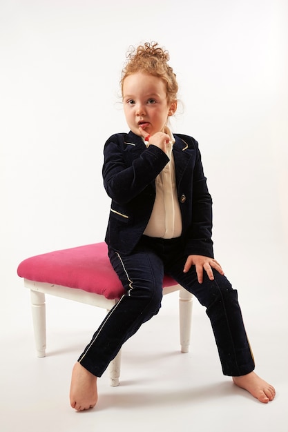 Photo little girl fashion model in black suit