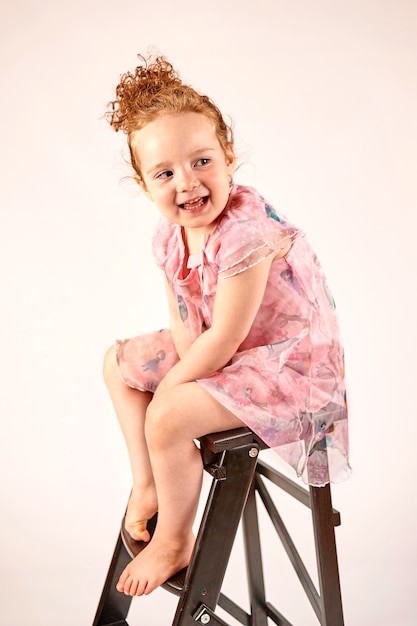 Little Girl Fashion Model in Rose Dress