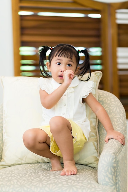 Little girl feeling itchy on her nose