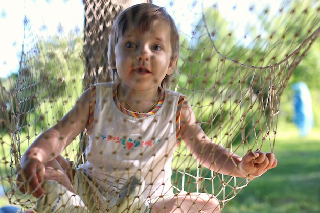 Little girl in hammock nature summer